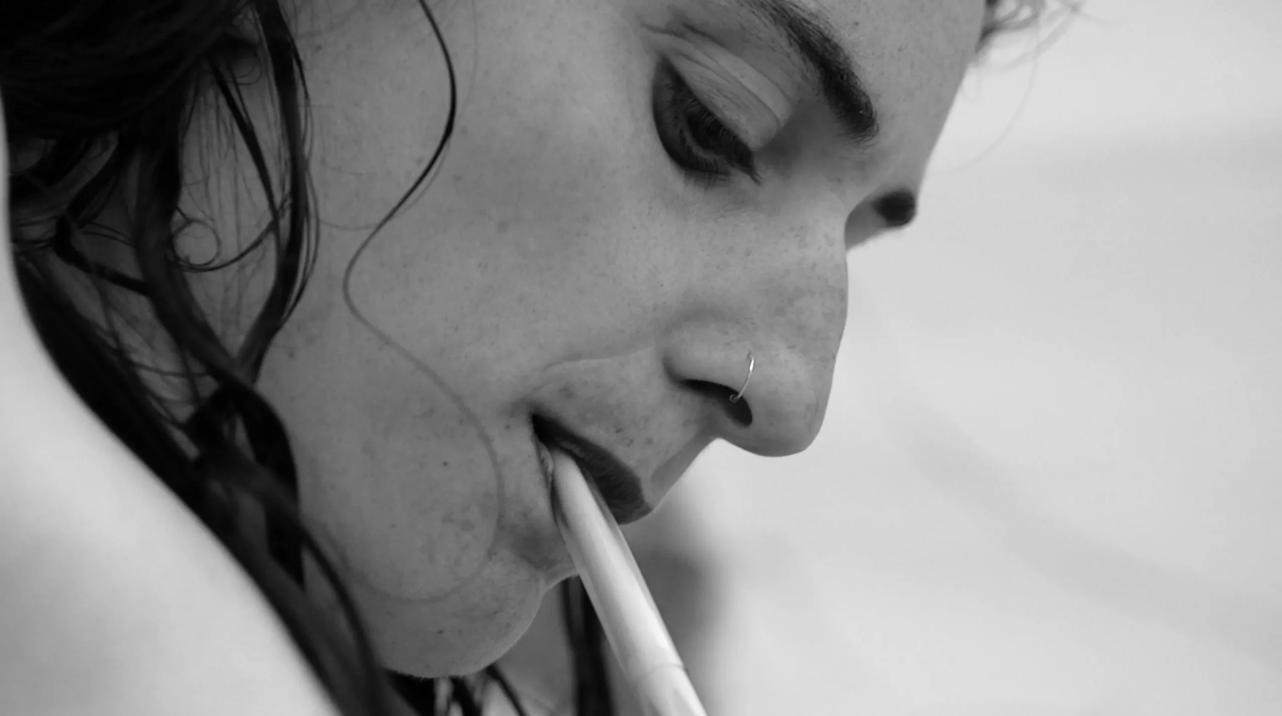 Eva Moro with a paintbrush between her teeth — Lost